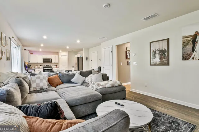 a living room with furniture and a couch