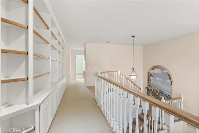 a view of a hallway with staircase