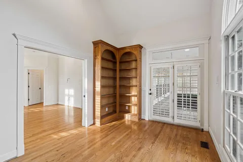 a view of livingroom with hardwood floor and a ceiling fan
