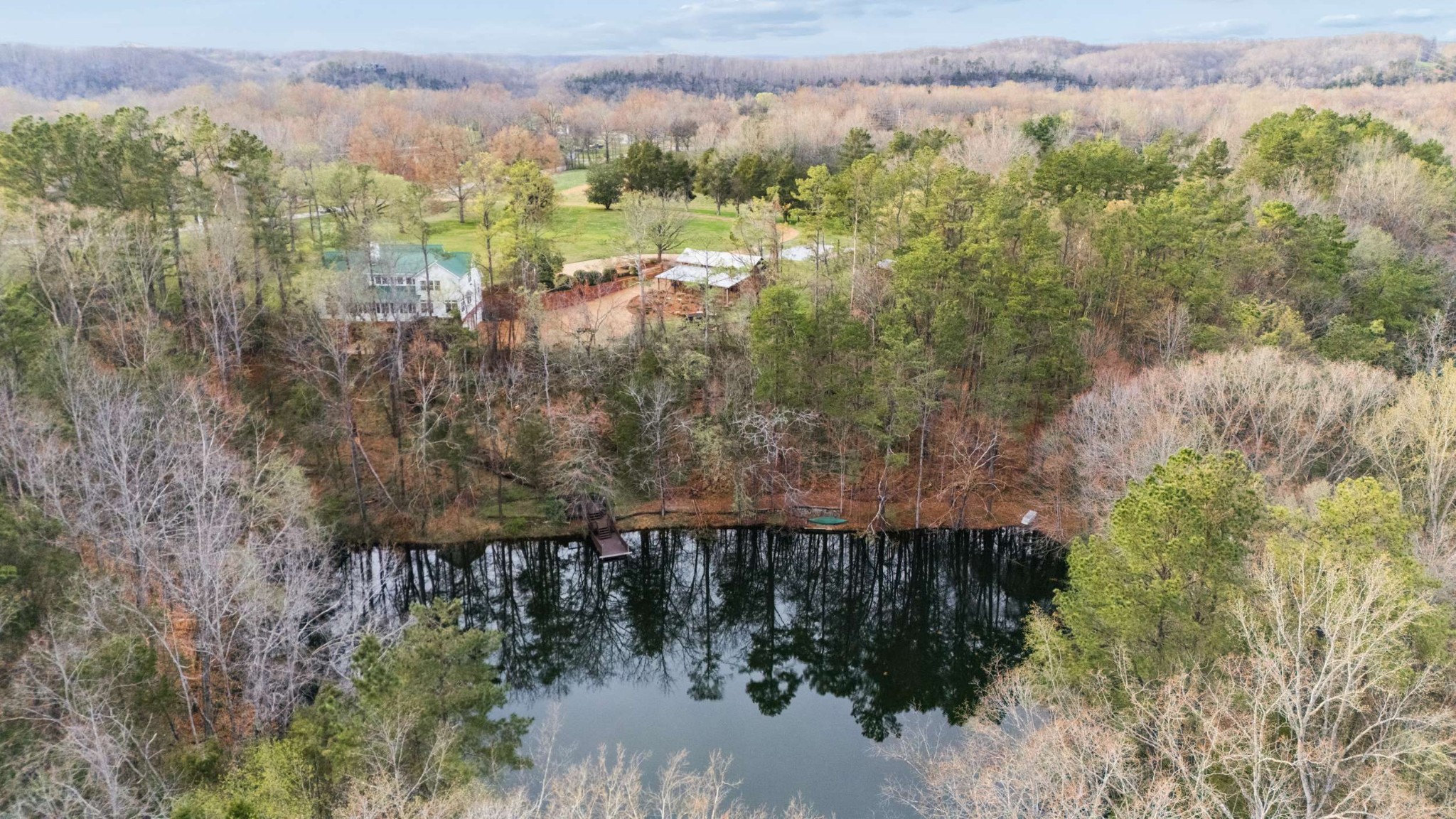324 East Kingston Springs Road Kingston Springs, TN 37082 - Photo 4 of 86 a view of a lake with a mountain in the background