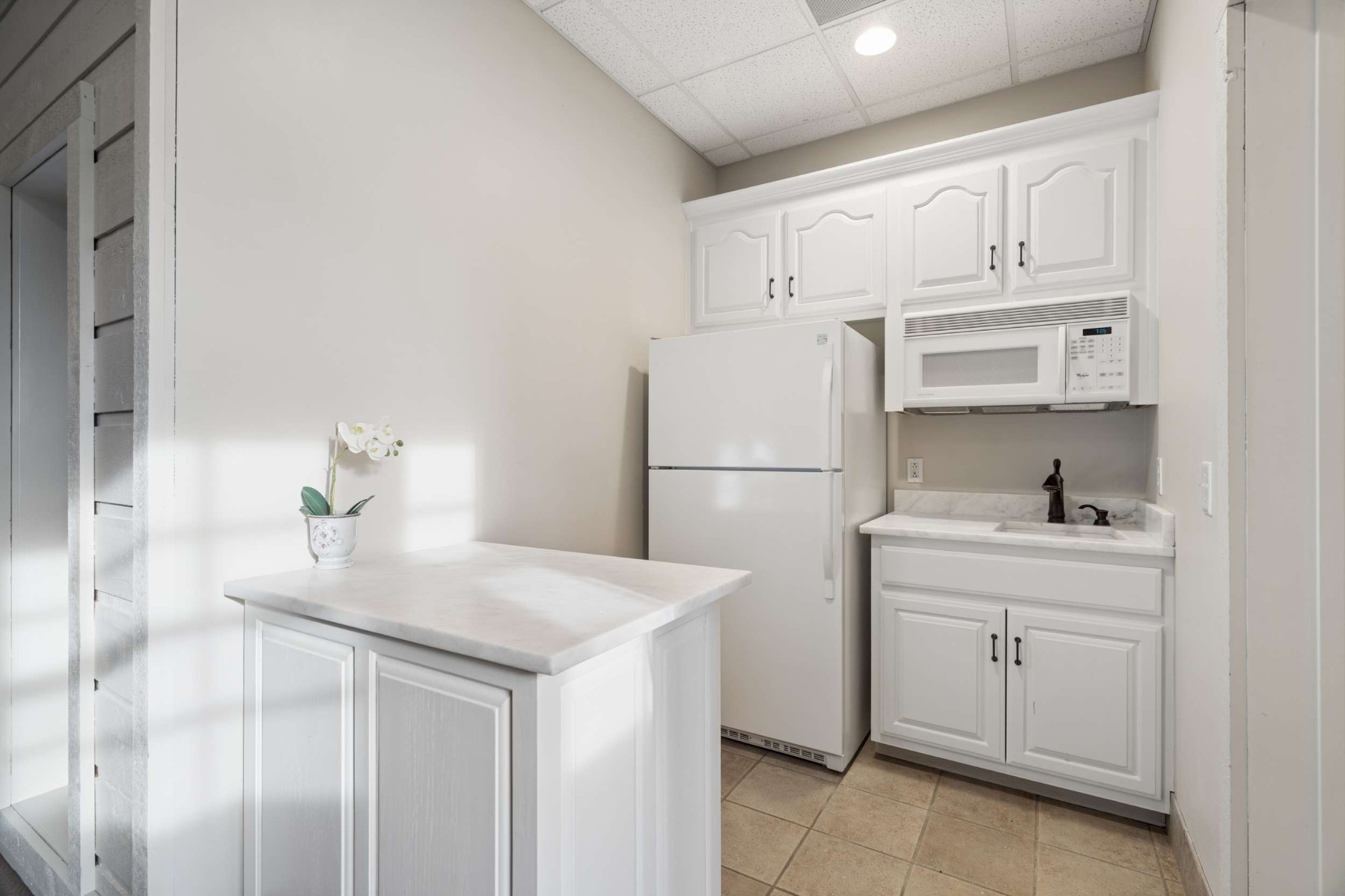 324 East Kingston Springs Road Kingston Springs, TN 37082 - Photo 54 of 86 a kitchen with white cabinets and white appliances
