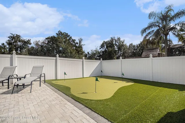 a view of a swimming pool and lounge chair
