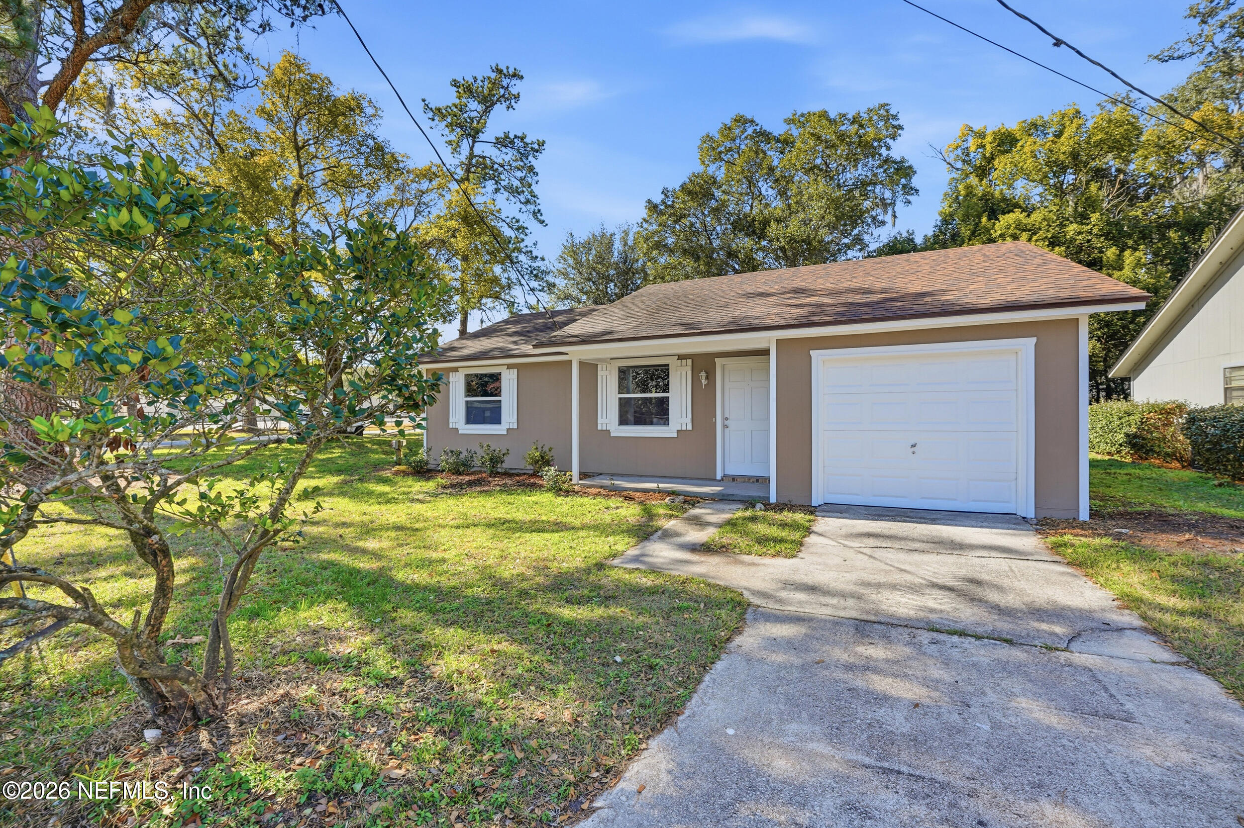 3084 Parental Home Road Jacksonville, FL 32216 - Photo 1 of 31 a view of a house with a yard