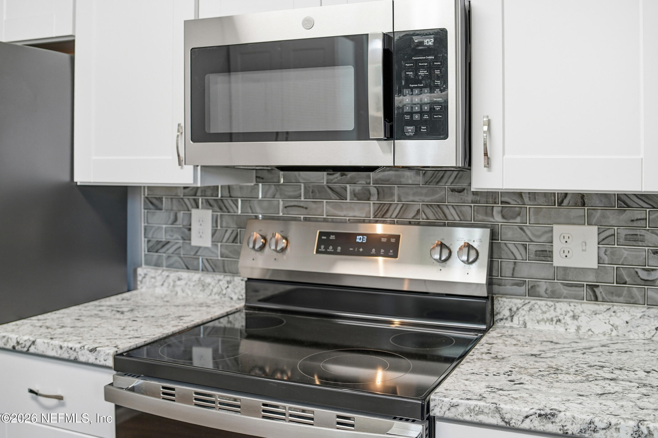 3084 Parental Home Road Jacksonville, FL 32216 - Photo 14 of 31 a stove top oven sitting inside of a kitchen