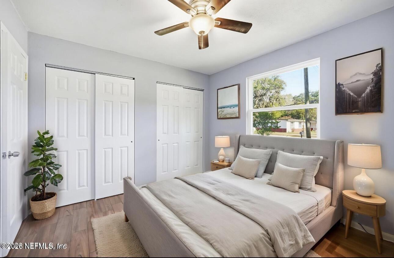 3084 Parental Home Road Jacksonville, FL 32216 - Photo 16 of 31 a bedroom with a bed and a potted plant