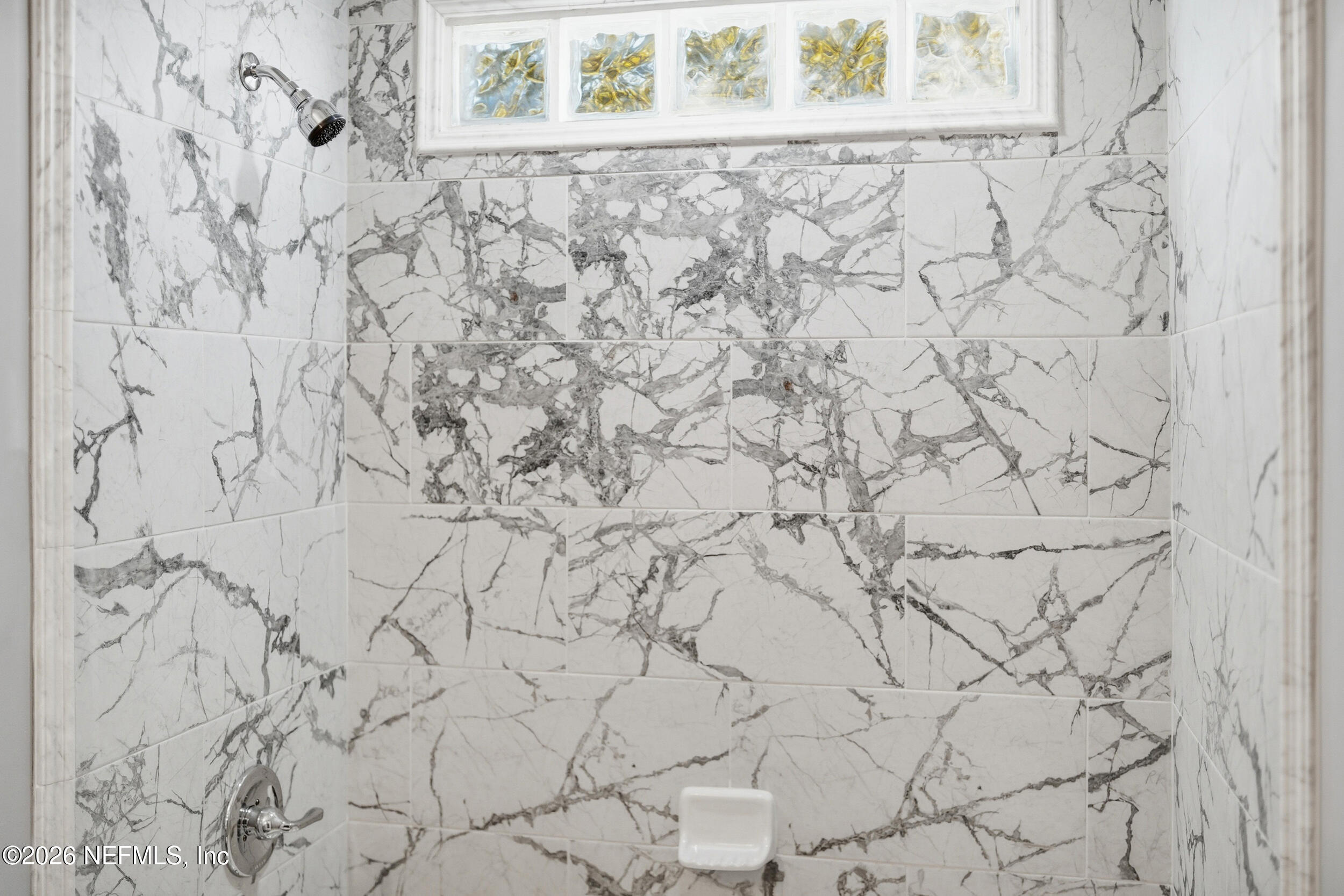 3084 Parental Home Road Jacksonville, FL 32216 - Photo 21 of 31 a bathroom with a bathtub