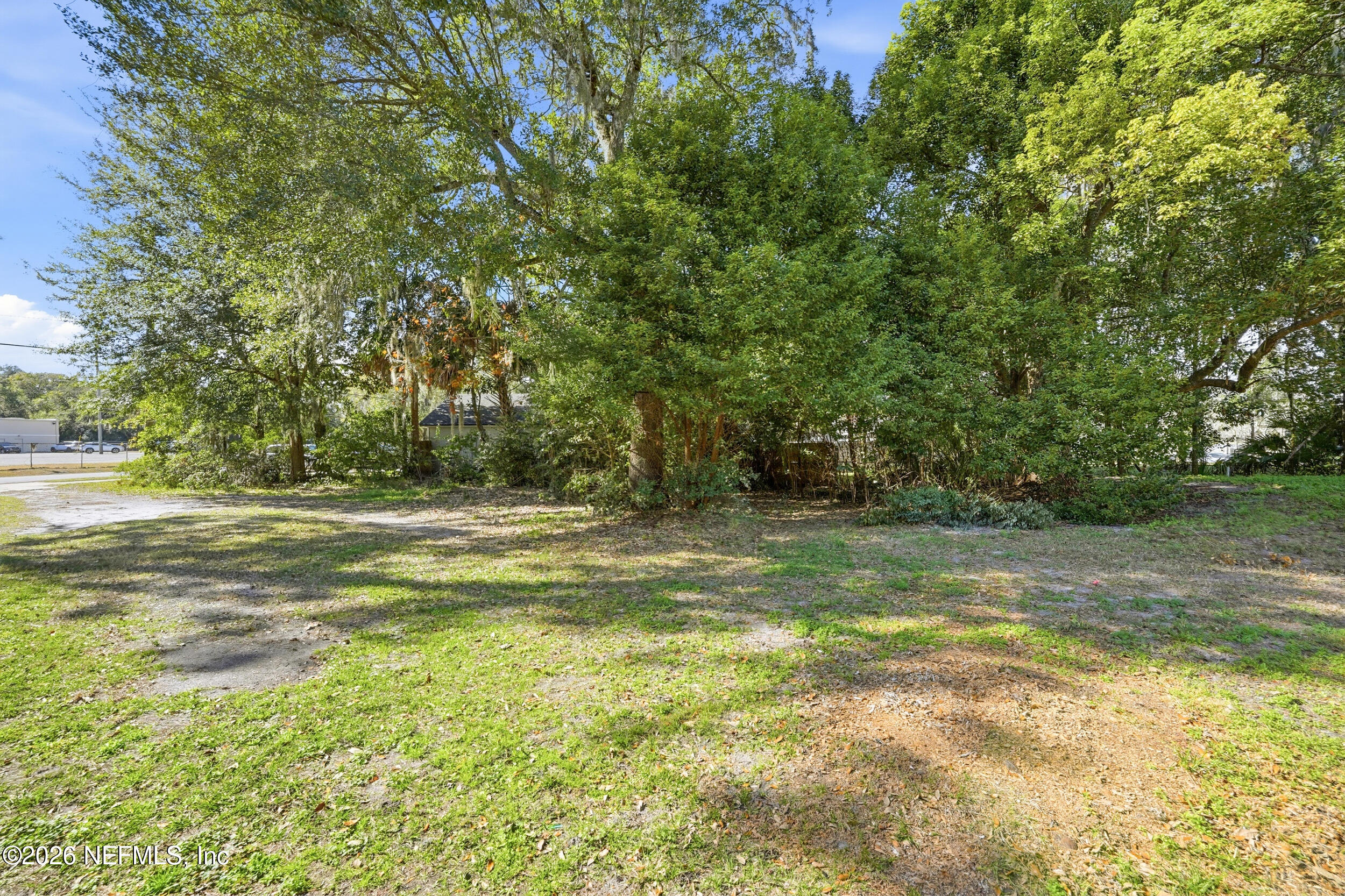 3084 Parental Home Road Jacksonville, FL 32216 - Photo 24 of 31 a view of a yard with a trees