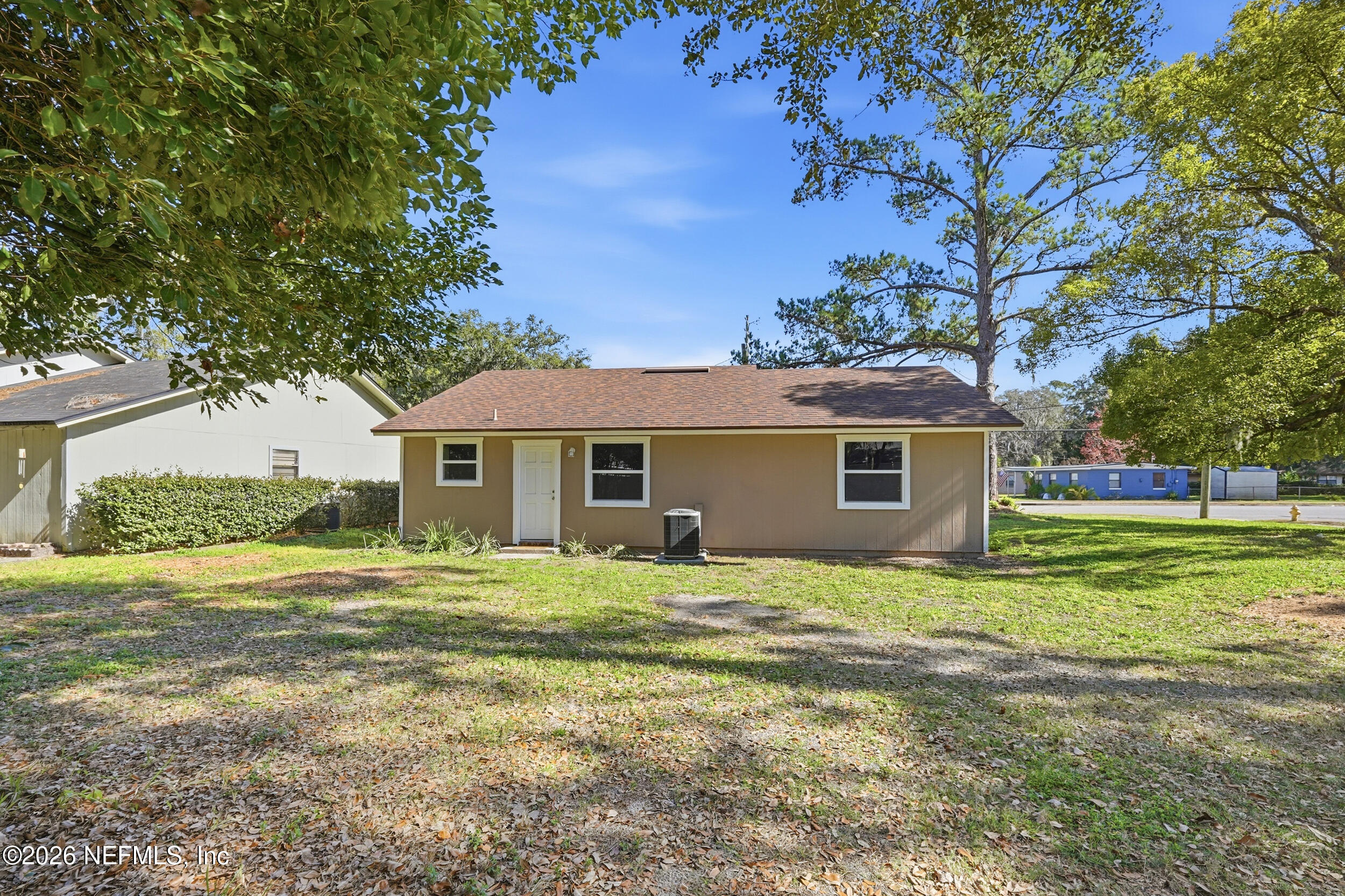 3084 Parental Home Road Jacksonville, FL 32216 - Photo 25 of 31 a front view of a house with a yard