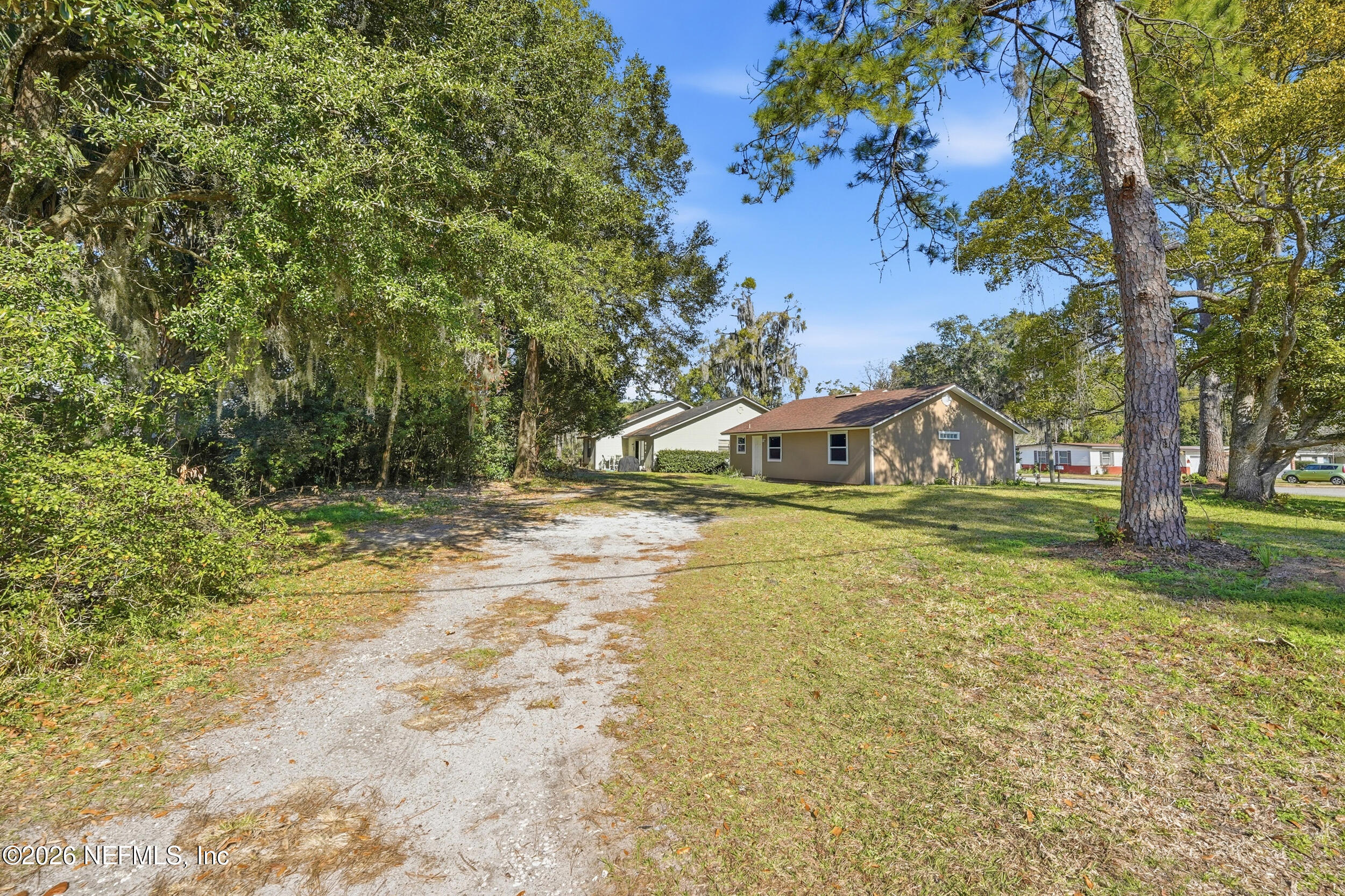 3084 Parental Home Road Jacksonville, FL 32216 - Photo 27 of 31 a view of a yard with plants and trees