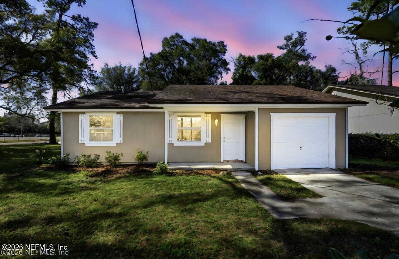 3084 Parental Home Road Jacksonville, FL 32216 - Photo 31 of 31 a front view of a house with a yard