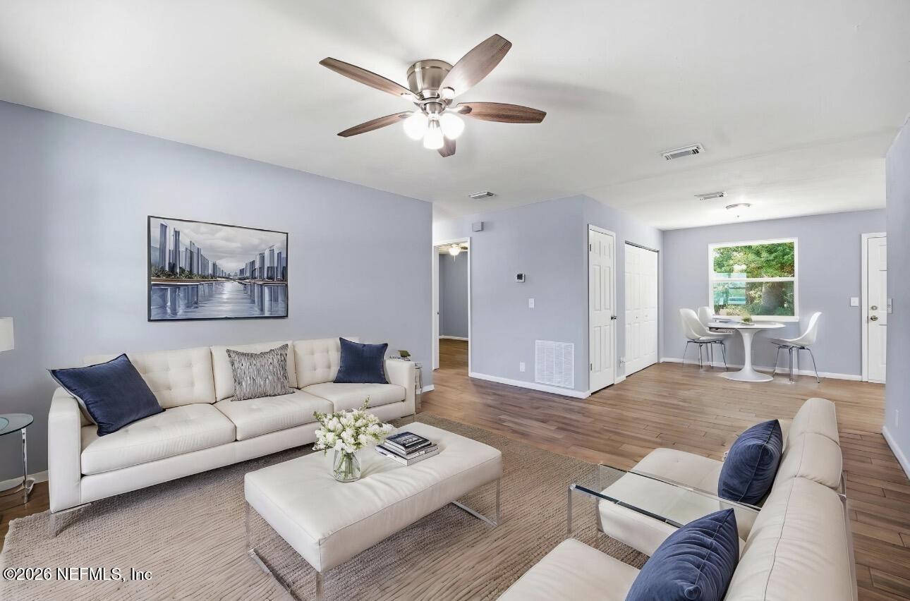 3084 Parental Home Road Jacksonville, FL 32216 - Photo 4 of 31 a living room with furniture and a large window