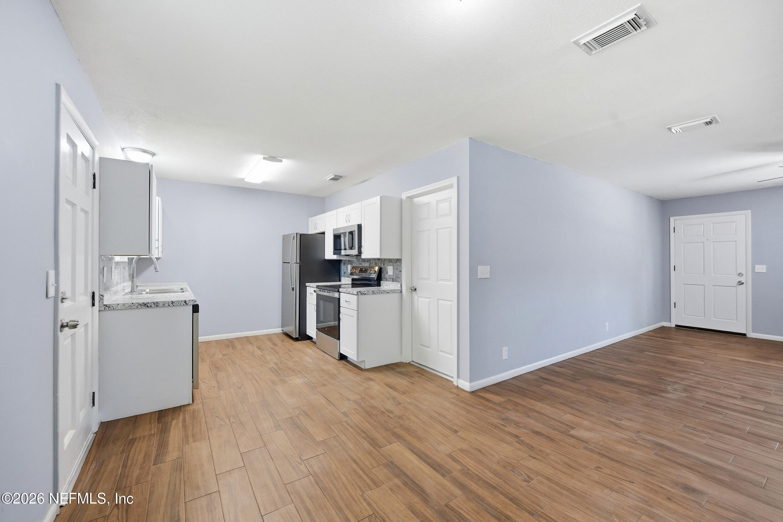 3084 Parental Home Road Jacksonville, FL 32216 - Photo 5 of 31 a view of kitchen with wooden floor