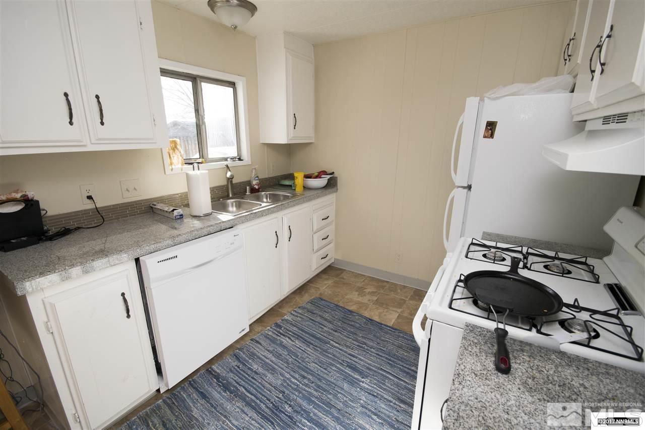 17795 Fantail Circle Reno, NV 89508 - Photo 2 of 10 a kitchen with a sink a stove and cabinets