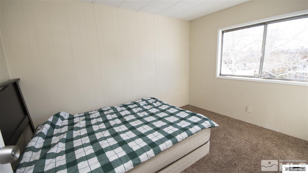 17795 Fantail Circle Reno, NV 89508 - Photo 8 of 10 a bedroom with a bed and a window