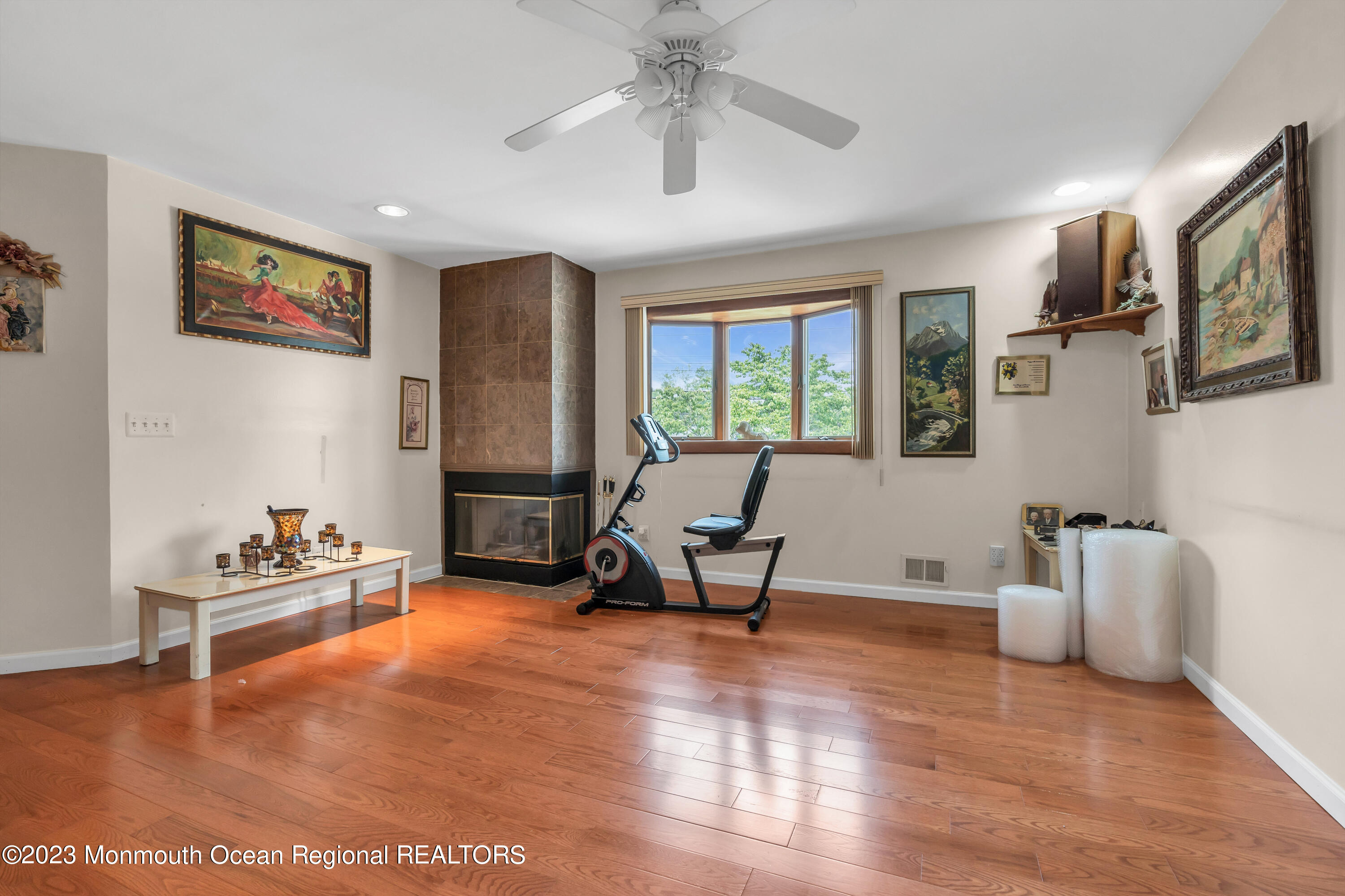 8 Willow Brook Road Freehold, NJ 07728 - Photo 1 of 49 a living room with furniture and a wooden floor