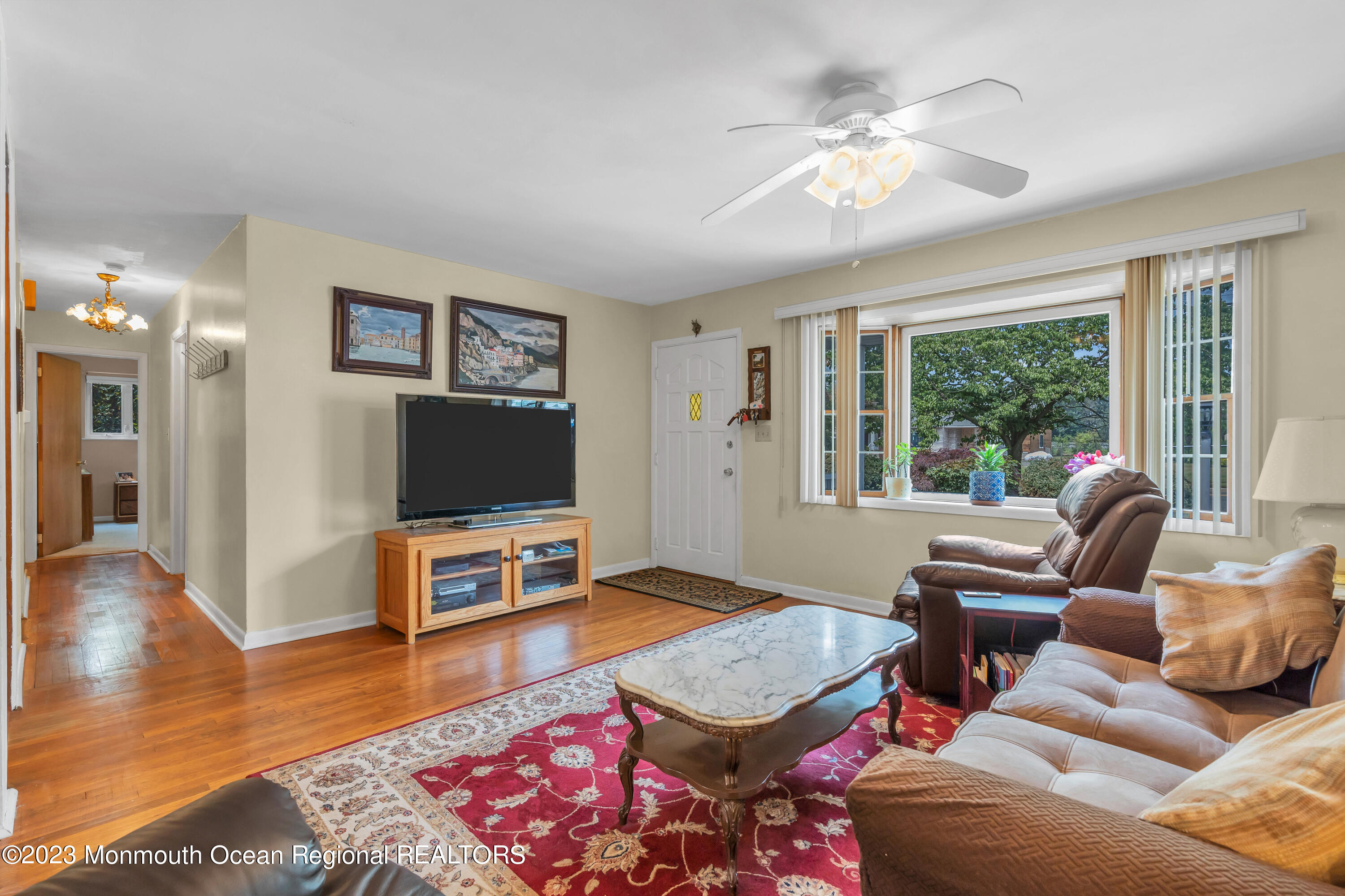 8 Willow Brook Road Freehold, NJ 07728 - Photo 20 of 49 a living room with furniture and a flat screen tv