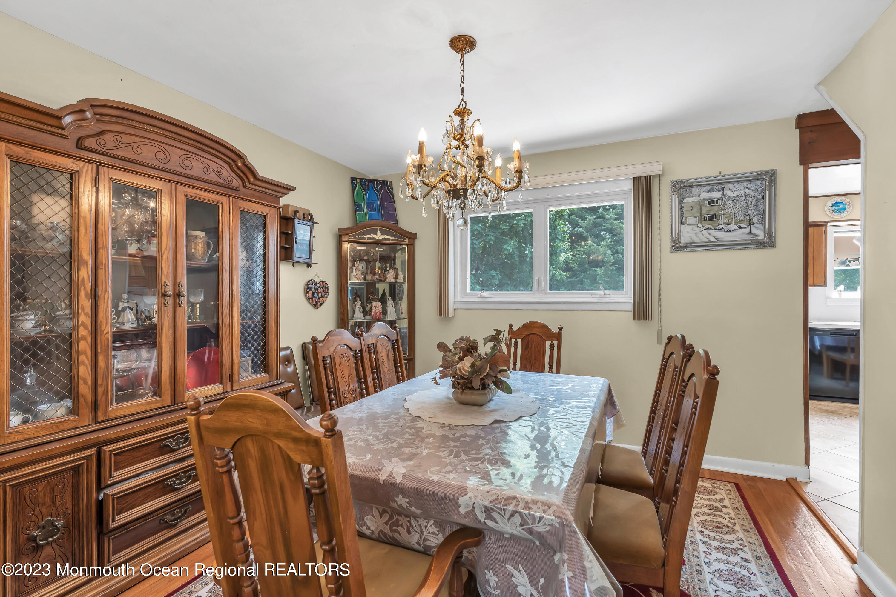 8 Willow Brook Road Freehold, NJ 07728 - Photo 21 of 49 a view of a dining room with furniture a chandelier and wooden floor