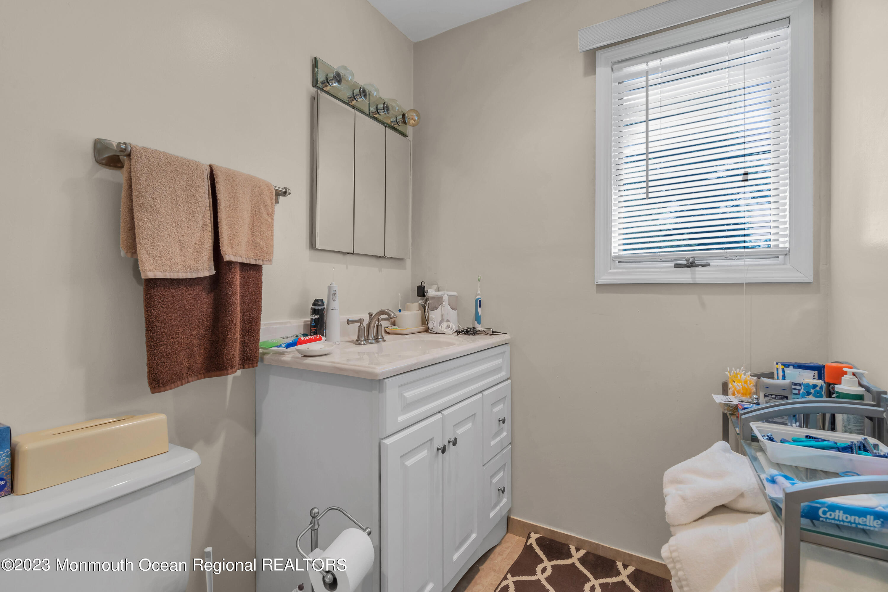 8 Willow Brook Road Freehold, NJ 07728 - Photo 4 of 49 a bathroom with a sink toilet vanity and tub