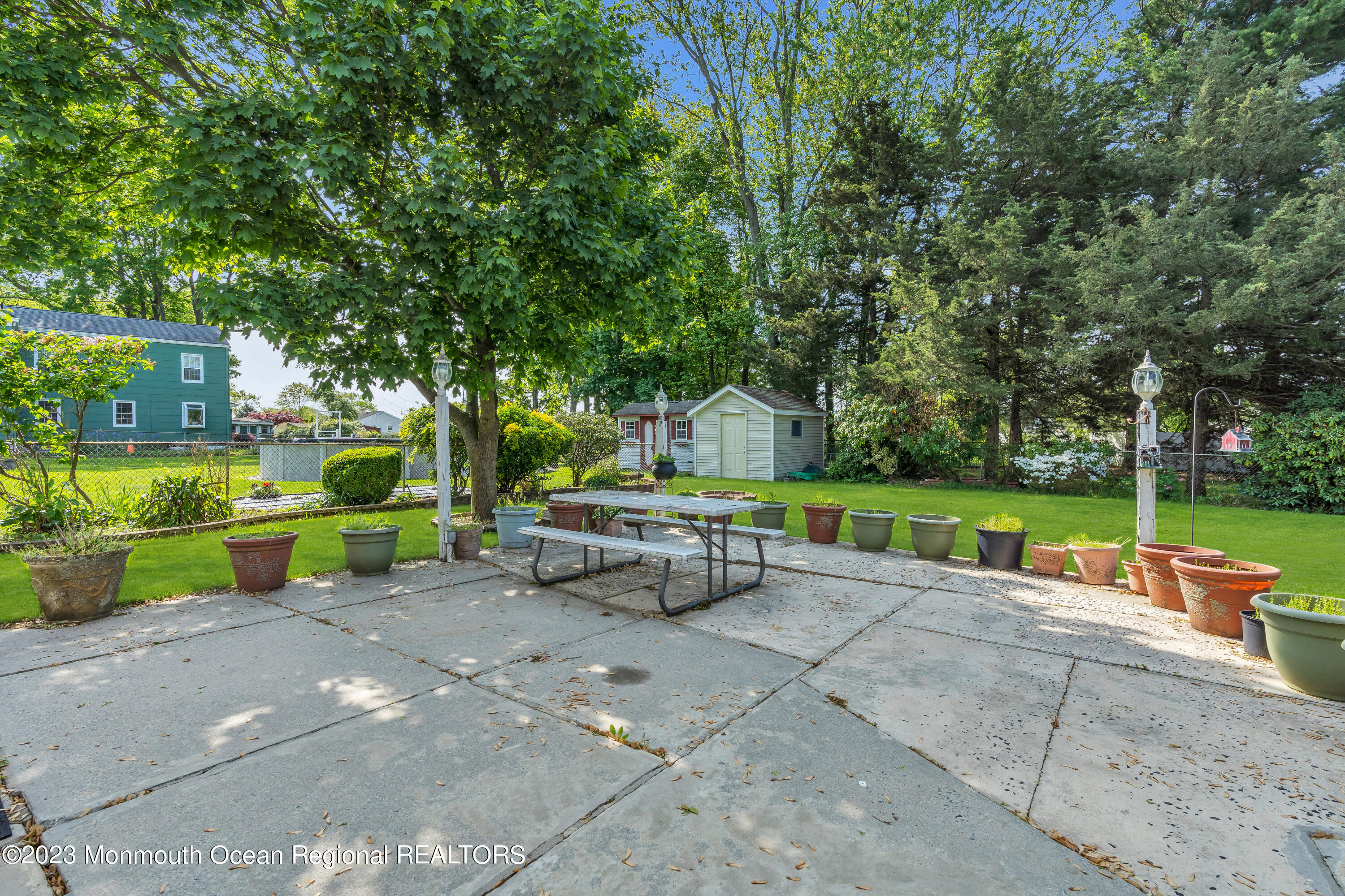 8 Willow Brook Road Freehold, NJ 07728 - Photo 6 of 49 a view of backyard with swimming pool and green space