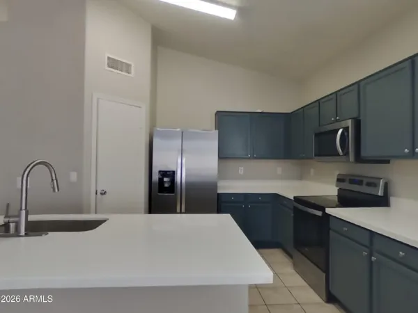 a kitchen with a sink and cabinets