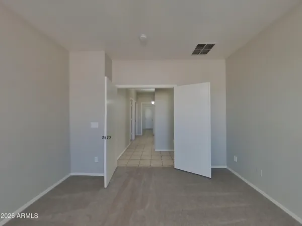 a kitchen with stainless steel appliances kitchen island a sink a refrigerator and cabinets