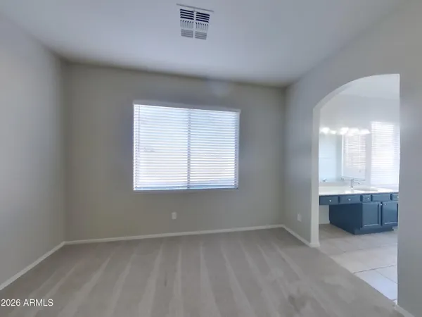 a view of an empty room and closet