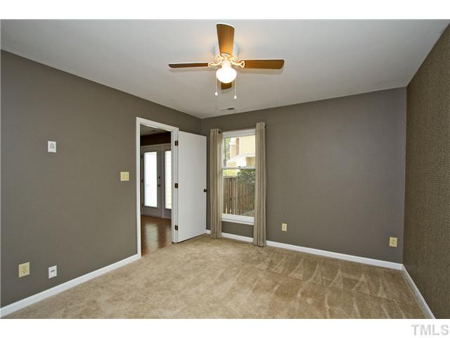 3205 Mill Run Raleigh, NC 27612 - Photo 13 of 22 a view of an empty room with window and cabinet