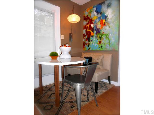 3205 Mill Run Raleigh, NC 27612 - Photo 21 of 22 a view of a dining room with furniture and wooden floor