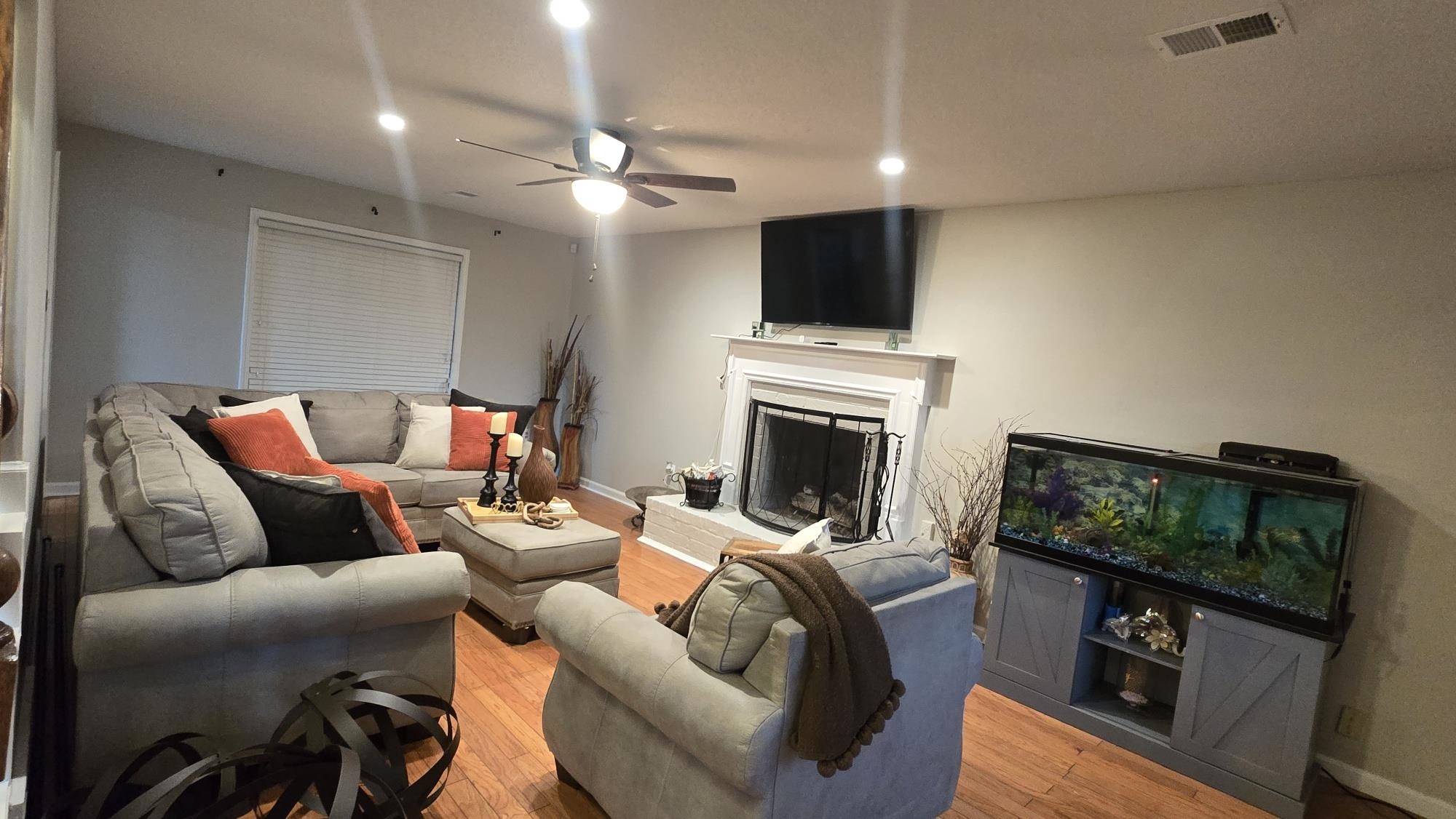 Living area featuring visible vents, recessed lighting, light wood-style flooring, and ceiling fan