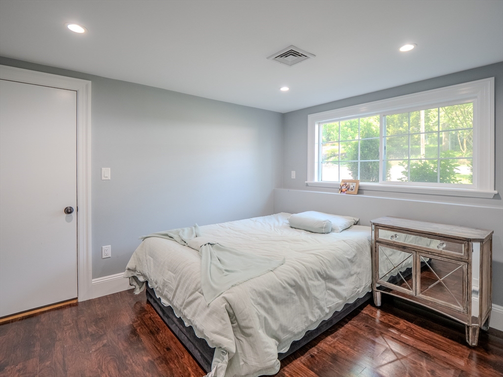 159 Mishawum Road Woburn, MA 01801 - Photo 23 of 41 a bedroom with a bed and a window