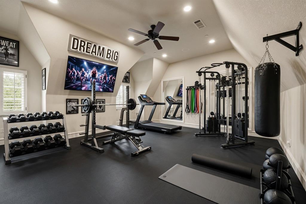 6900 Rockingham Court Colleyville, TX 76034 - Photo 24 of 40 Home Gym, Yoga, Dance, or Boxing Studio featuring dark rubber flooring, sloped ceilings, and recessed lighting. Ai staged.