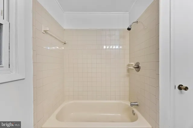 a close view of a bathtub in bathroom