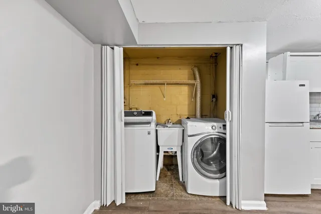 a view of a hallway with washer and dryer