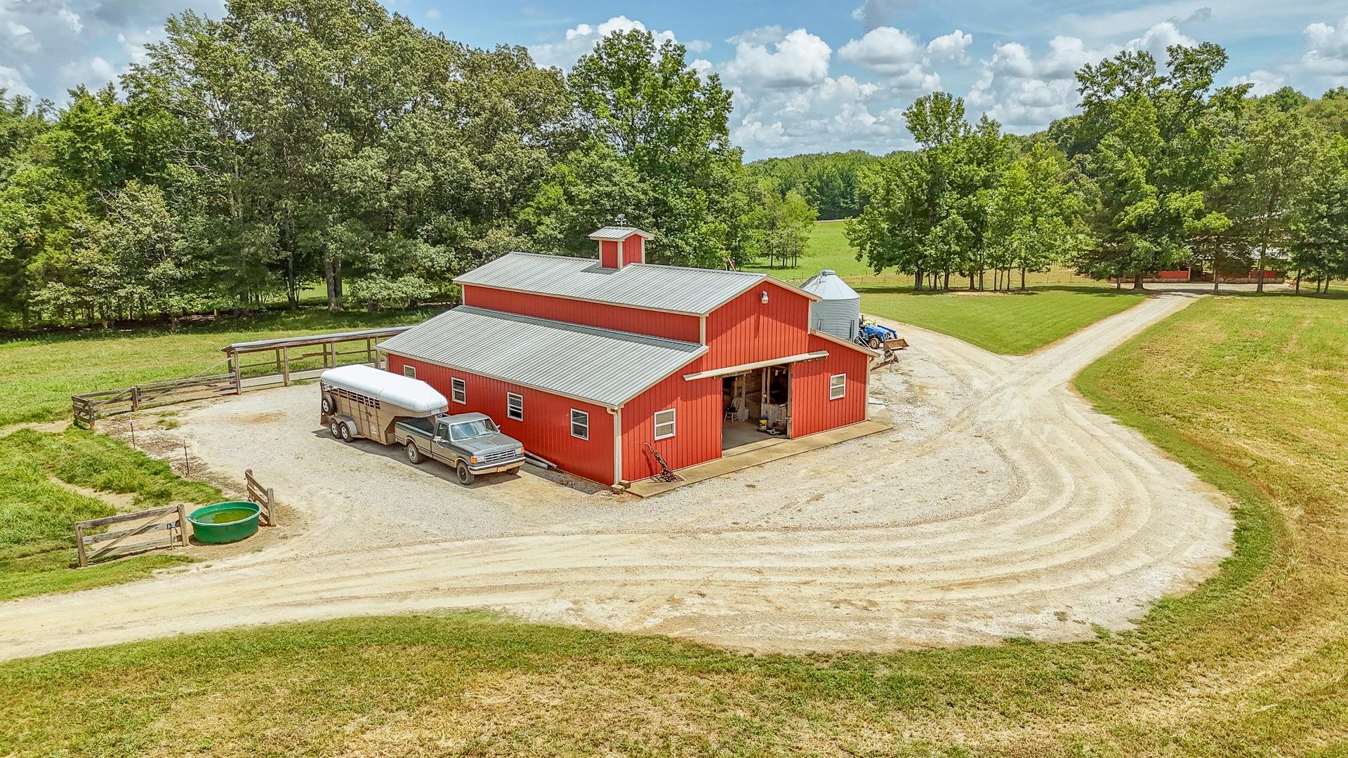 2690 Fellowship Road Sardis, TN 38371 - Photo 2 of 40 a white and red ocean with trees in the background