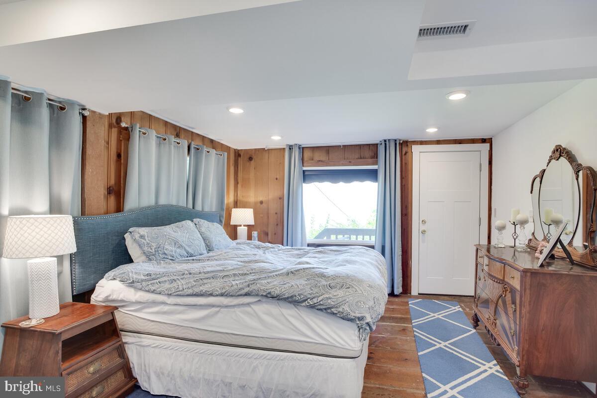 2144 Cedar Road Port Republic, MD 20676 - Photo 40 of 56 a bedroom with a large bed and a dresser