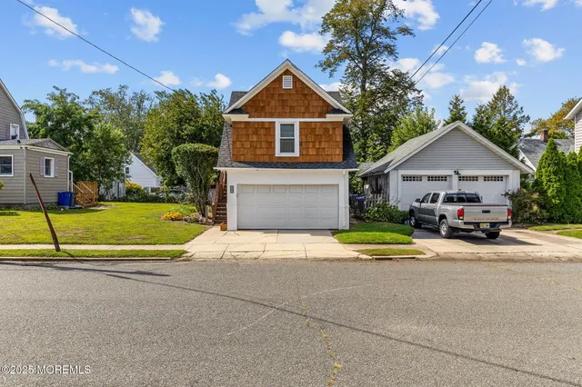 a view of house with outdoor space and swimming pool