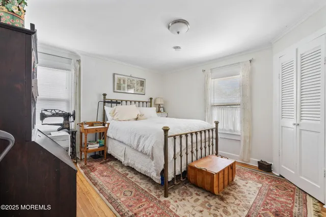 a bedroom with a bed and a table in it