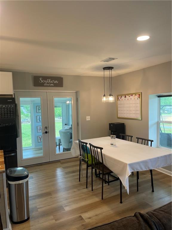 433 Spring Place Resaca Road Chatsworth, GA 30705 - Photo 20 of 51 a view of a dining room with furniture window and wooden floor