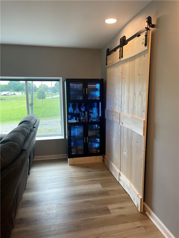 433 Spring Place Resaca Road Chatsworth, GA 30705 - Photo 21 of 51 a room with furniture and a floor to ceiling window