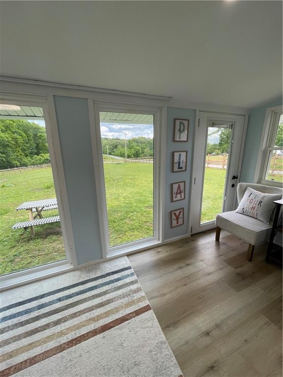 433 Spring Place Resaca Road Chatsworth, GA 30705 - Photo 24 of 51 a view of an empty room with wooden floor and a window