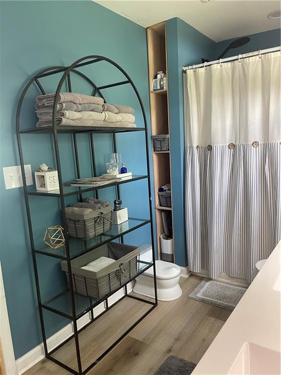433 Spring Place Resaca Road Chatsworth, GA 30705 - Photo 27 of 51 a living room with furniture and a wooden floor