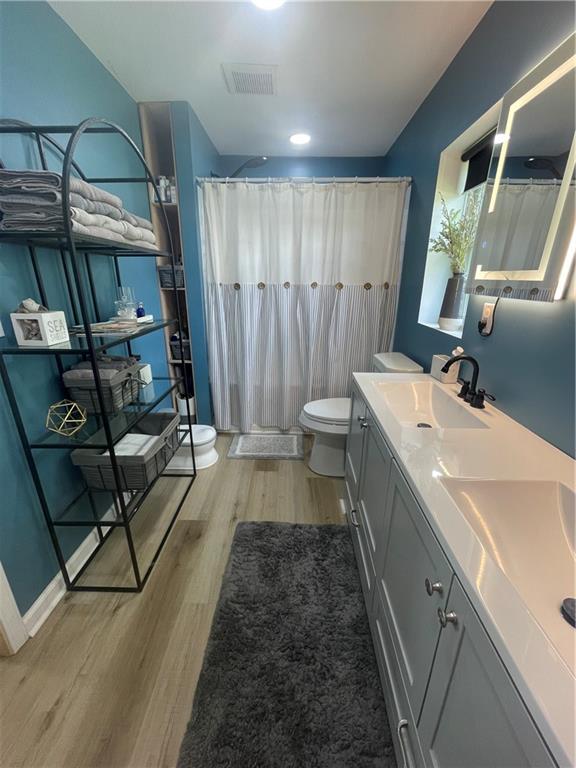 433 Spring Place Resaca Road Chatsworth, GA 30705 - Photo 28 of 51 a bathroom with double vanity sink and a mirror