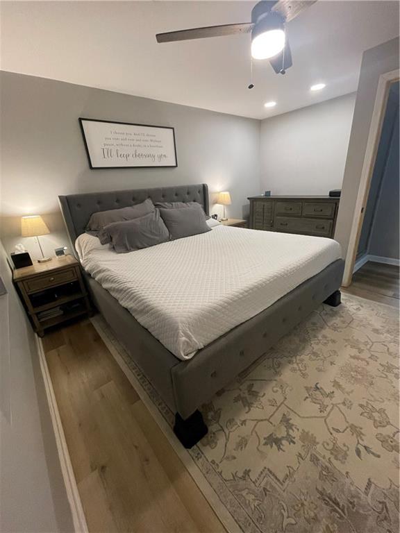 433 Spring Place Resaca Road Chatsworth, GA 30705 - Photo 31 of 51 a bedroom with a bed and a night stand