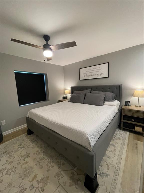 433 Spring Place Resaca Road Chatsworth, GA 30705 - Photo 32 of 51 a bedroom with a large bed a chandelier and dresser