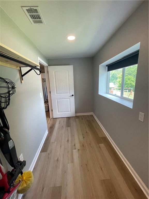 433 Spring Place Resaca Road Chatsworth, GA 30705 - Photo 40 of 51 a view of empty room with wooden floor and fan