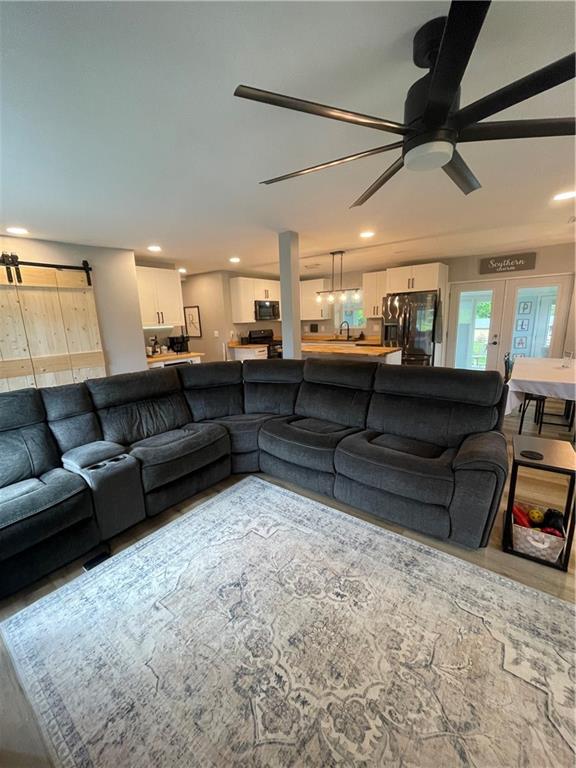 433 Spring Place Resaca Road Chatsworth, GA 30705 - Photo 5 of 51 a living room with furniture and a flat screen tv