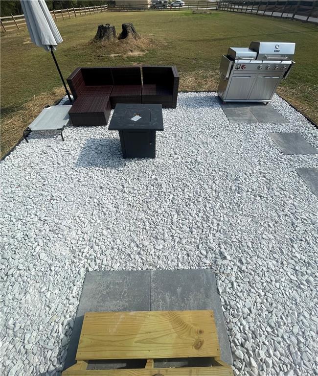 433 Spring Place Resaca Road Chatsworth, GA 30705 - Photo 6 of 51 a view of swimming pool with a table and chairs in wooden floor