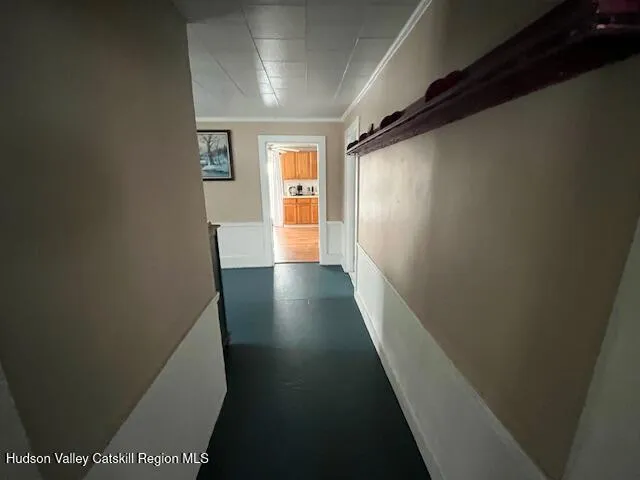 a view of entryway with stairs and wooden floor