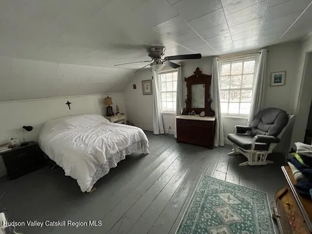 a bed room with a bed and a television