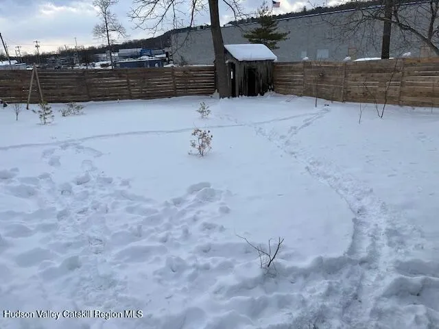a view of snow on the side of a road